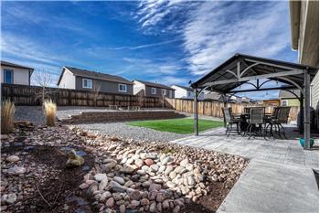 View of fenced backyard.