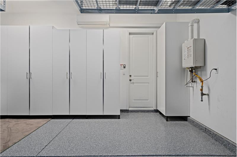 Garage with AC/Cabinetry and Storage racks