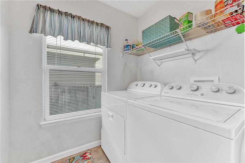 Laundry room is close to the garage and kitchen on the main level!