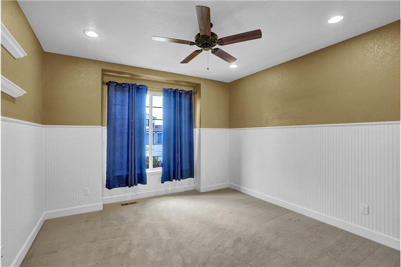 Main level Bedroom #3 with lighted ceiling fan