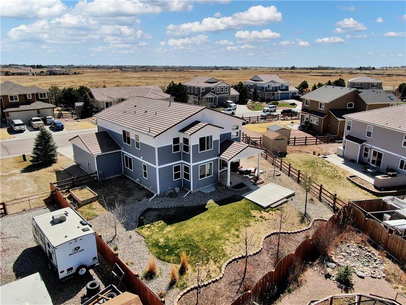 Aerial view of home and fenced backyard