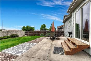 Expansive backyard patio, ideal for outdoor dining and entertaining.