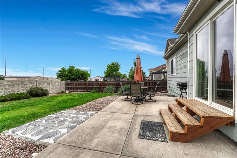 Expansive backyard patio, ideal for outdoor dining and entertaining.