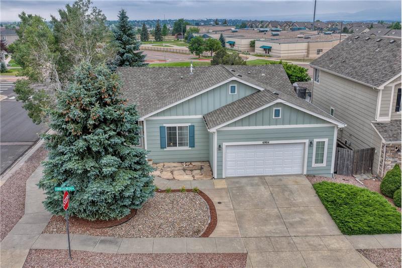 Exceptional curb appeal features a xeriscaped yard, mature trees for shade & privacy, and a flagstone patio.