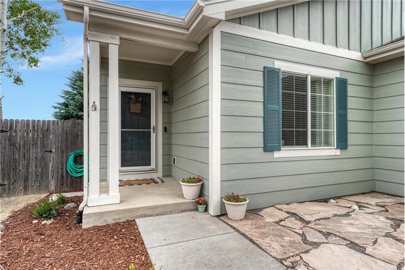 Covered front porch and flagstone patio.