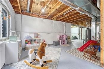 The unfinished basement has space for an awesome play room or craft room for the kids.