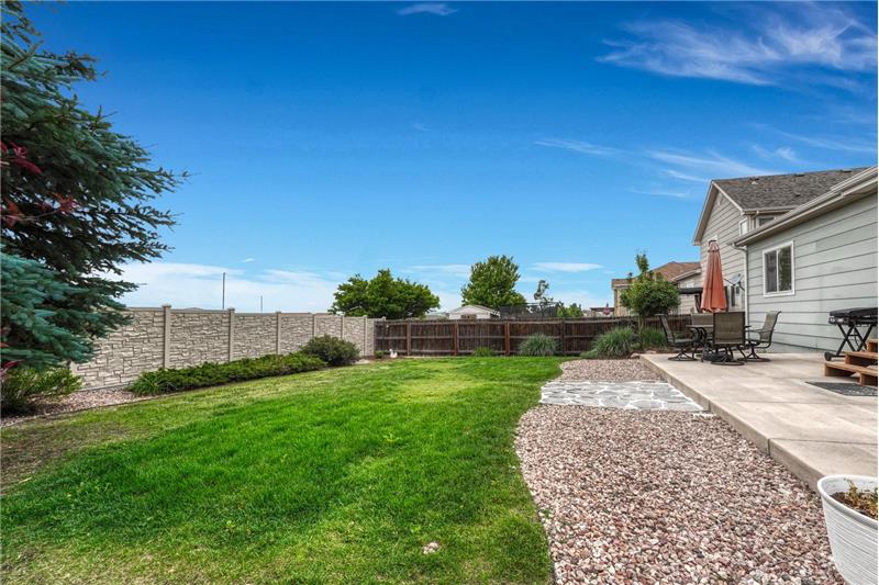 Large fenced backyard for outdoor fun and relaxation.