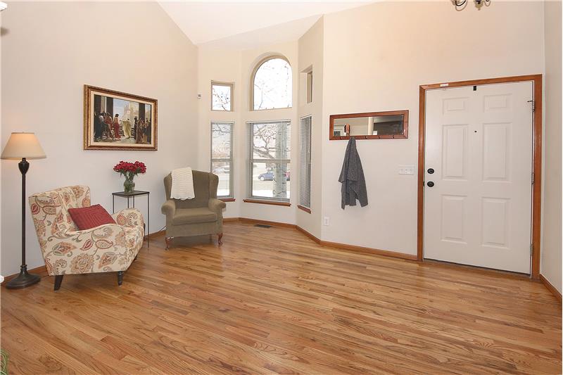 View of living room with plentiful windows and entry