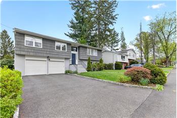 Modern living in the heart of Hartsdale, offering lots of space and updates in a cul-de-sac location