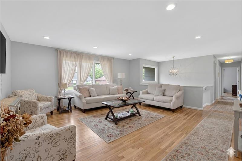 Inviting spacious open living area  making it ideal for both entertaining and  relaxation with hardwood floors throughout