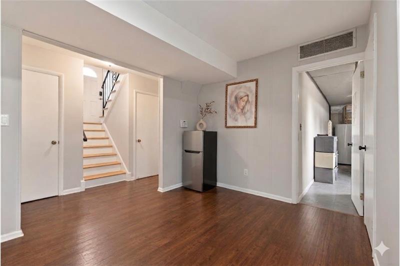 Bright open lower level with sliding glass doors to the patio and backyardideal for recreation, a home gym, and Family room