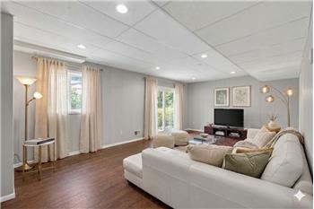 Warm and inviting family room with seamless access to the patio and backyardperfect for indoor-outdoor living and entertaining
