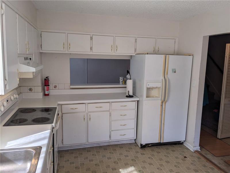 Kitchen view of window to dining area