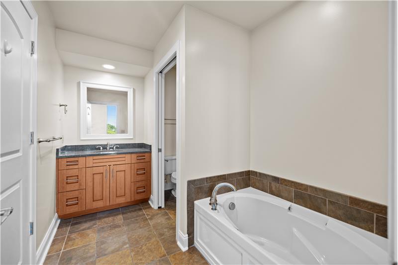 Primary bathroom features soaking tub