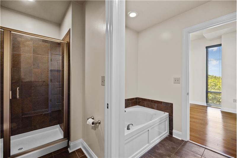 Primary bathroom features shower + tub