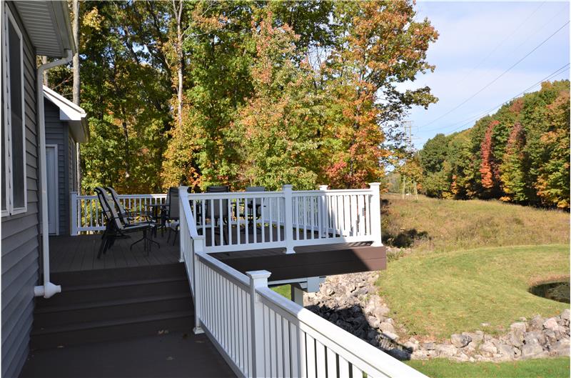 Enjoy the deck and beautiful yard.