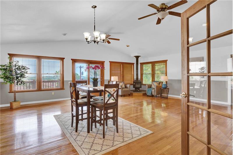 French doors from the Kitchen lead into a beautiful large addition that hosts a formal Dining Rm & Family Rm