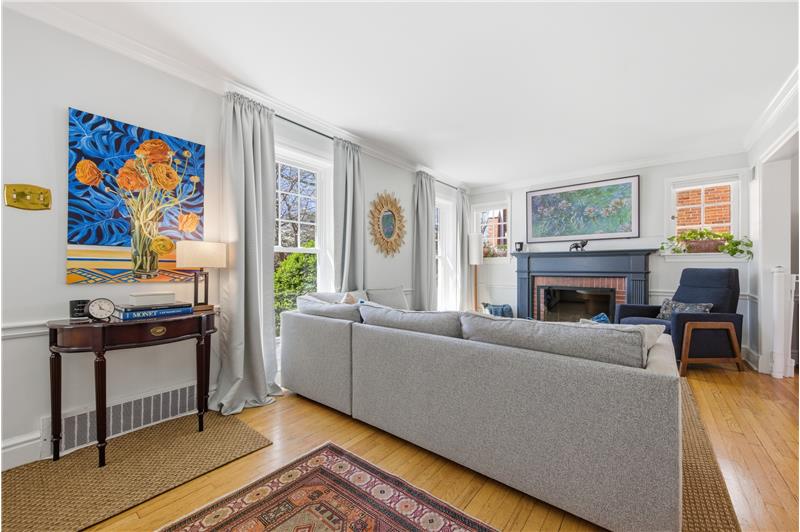 Living room with wood floors and a fireplace