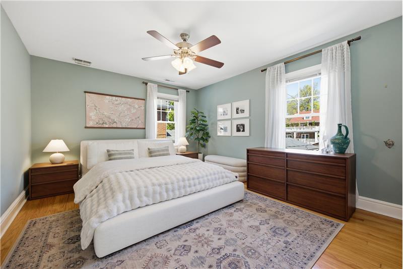 Primary bedroom with ceiling fan