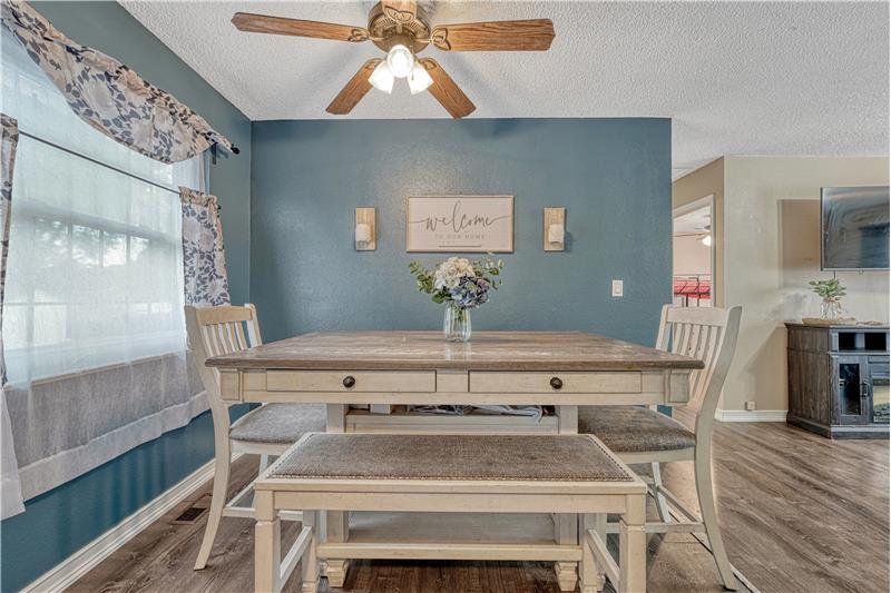 Dining area with window and ceiling fan