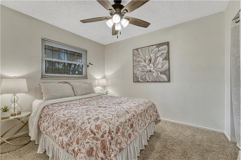 Freshly painted Primary bedroom with ceiling fan