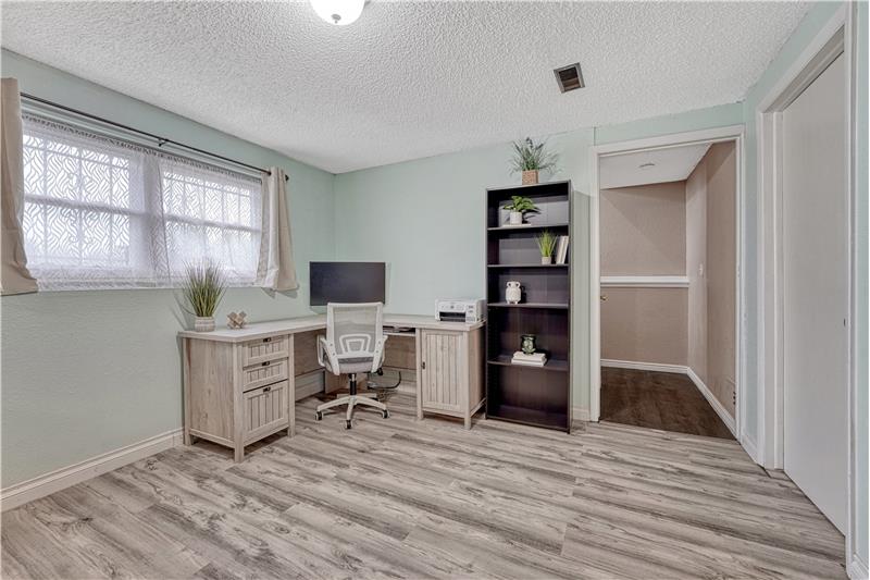 Lower level rec room is spacious and offers room for an office