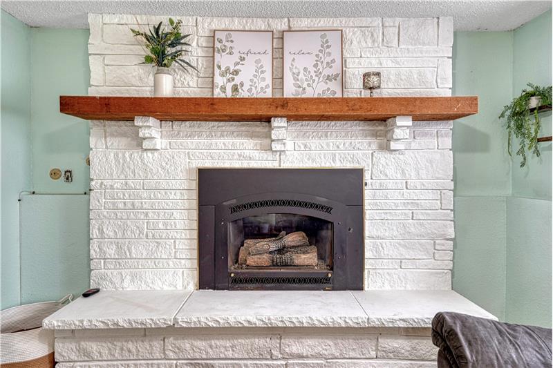 Cozy gas fireplace in lower level