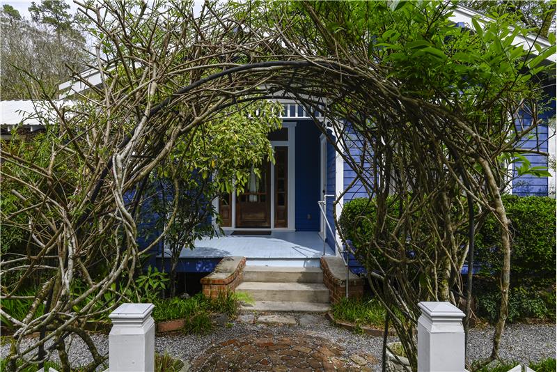 Peek through the Arbor to the inviting front porch