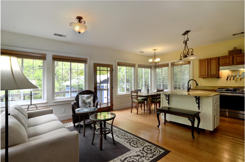 Open concept Den, kitchen, dining area