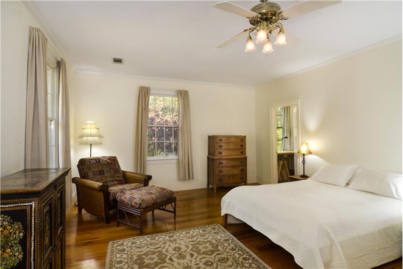 Spacious primary bedroom wing with 3 closets.