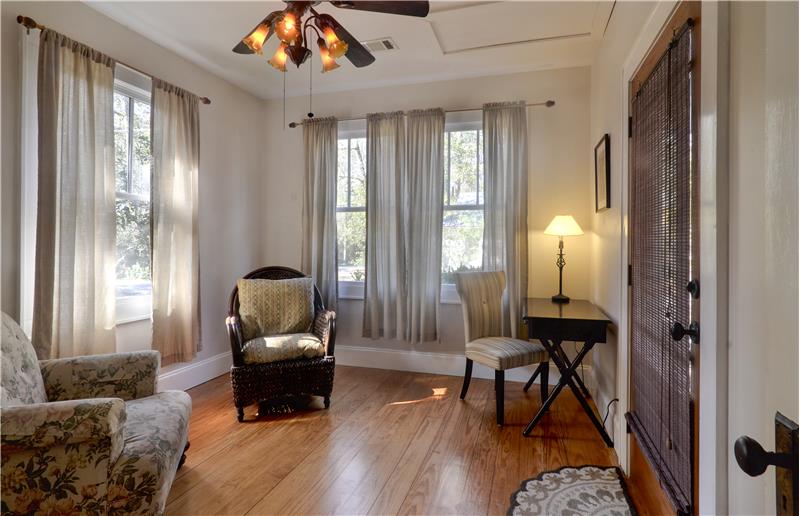 Front bedroom (right side of house) has its own entrance at porch.