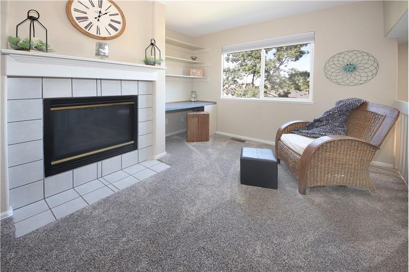 The Master Bedroom Retreat has a gas fireplace with tile surround and built-in shelves