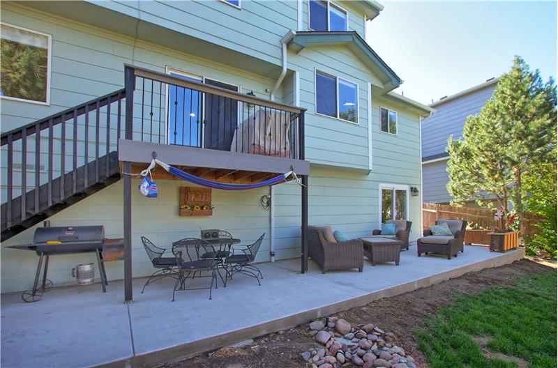 Nicely landscaped fenced lot that incl a newly expanded patio, storage shed, composite deck, dry riverbed, & firepit area