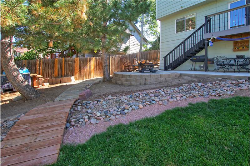 Dry riverbed and fire pit in the backyard