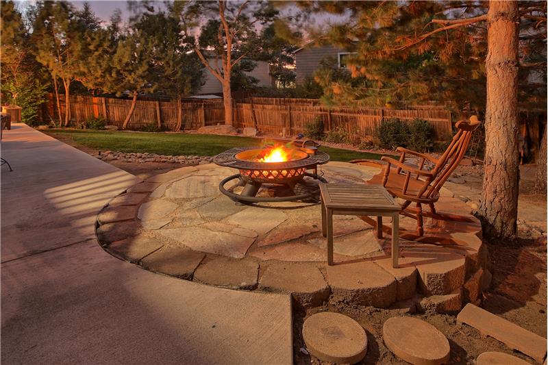 Enjoy the evening sunset around the backyard firepit