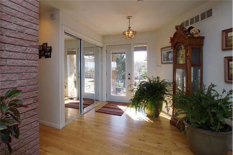 Entry foyer with newer wood flooring