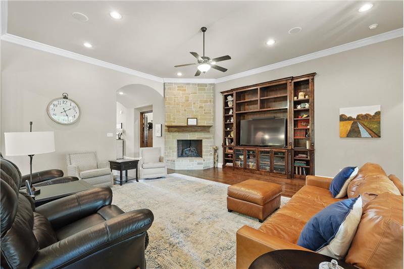 Stone fireplace and a wall of built ins