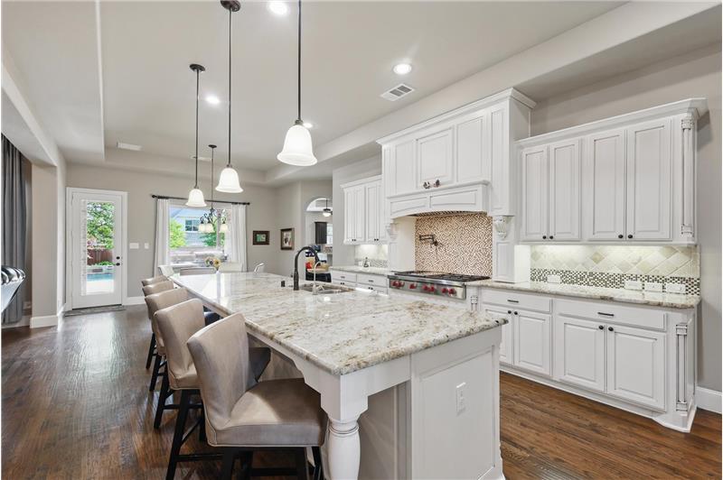 White cabinets, island seating
