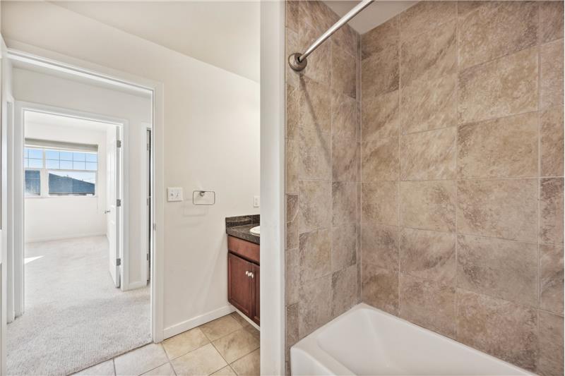 Full bathroom across from guest bedroom