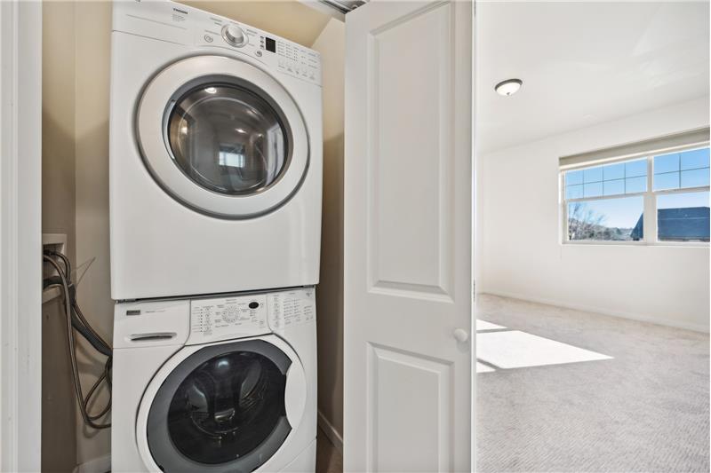 Laundry closet is next to the primary bedroom