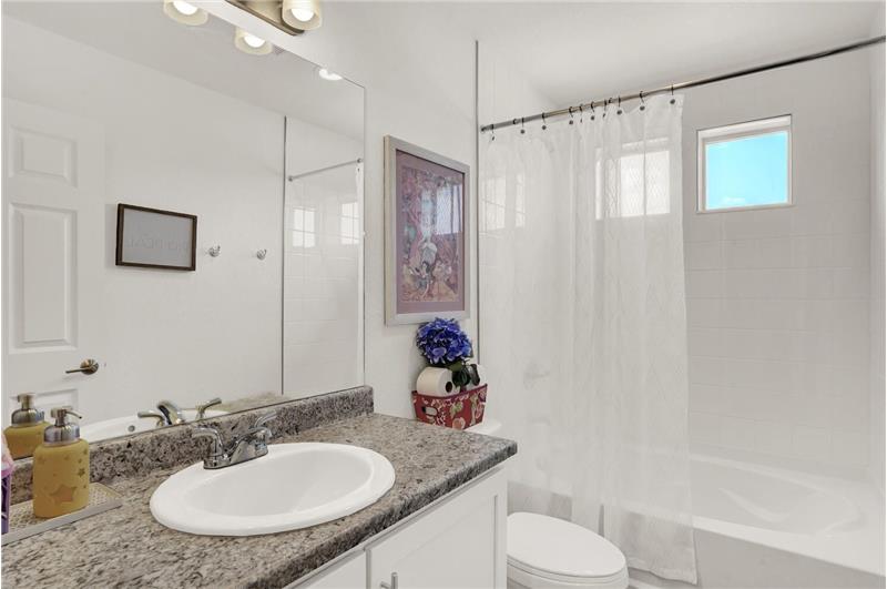 Upper-level full Bathroom with vanity and soaking tub/shower