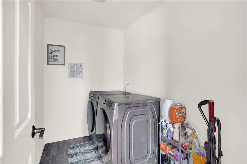 Upper-level Laundry Room with luxury vinyl plank floor