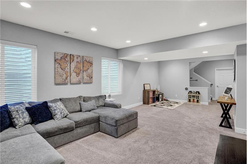 Basement Family Room with neutral carpet and recessed lighting