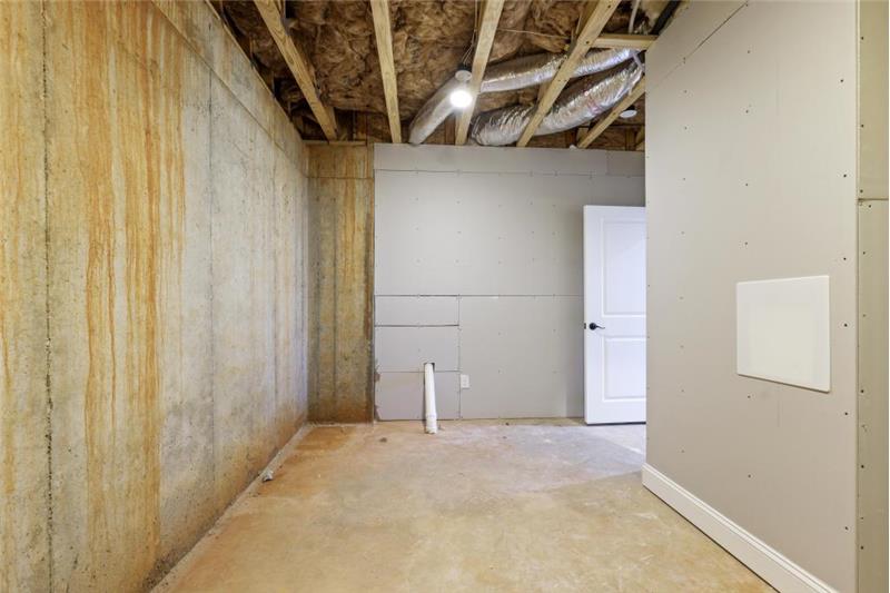 Storage area which houses a 2nd laundry room