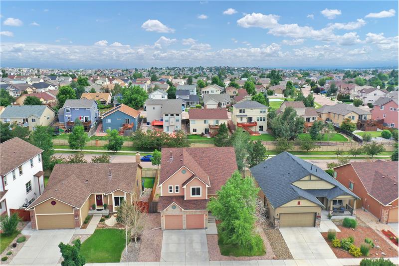 Aerial view of the front of the house and neighborhood