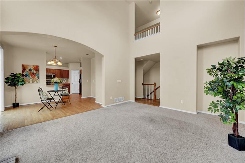 View of the Dining Area, Kitchen, and Upper-Level Hallway from the Family Room