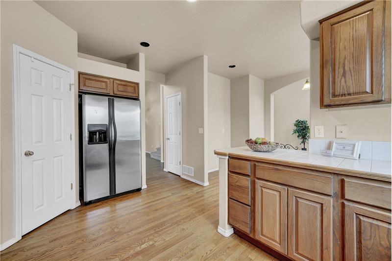 The Kitchen features a walk-in pantry and stainless-steel side by side refrigerator