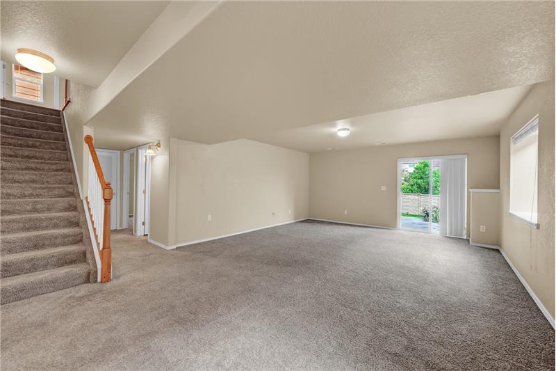 The finished Basement includes a Rec Room with a slider out to the backyard 