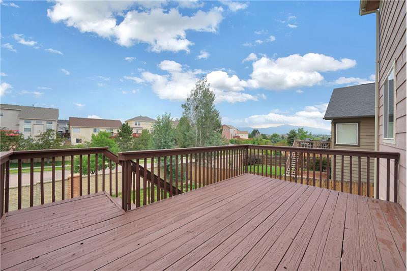 Wood deck with stairs to the backyard
