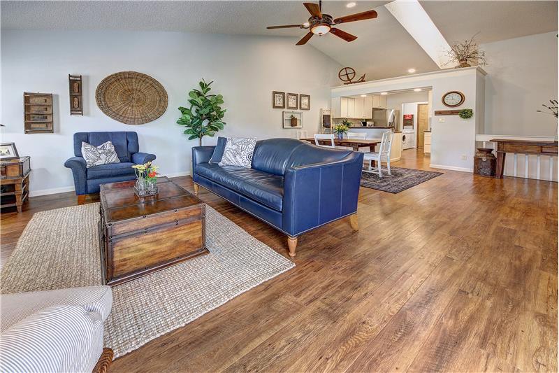 Vaulted ceilings, high grade wood laminate flooring, and recessed lighting